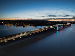 Bellevue WA USA - February 28th 2025: Peaceful dusk car lights at 520 Bridge