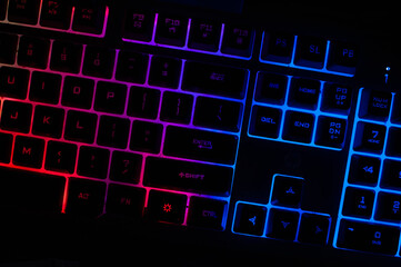 Vibrant RGB gaming keyboard, blurred for a dynamic feel. Perfect for tech, gaming, and design...