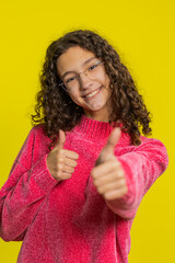 Like. Caucasian girl raises thumbs up agrees with something gives positive reply recommends...