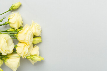 Beautiful bouquet with eustoma flowers on color background, top view