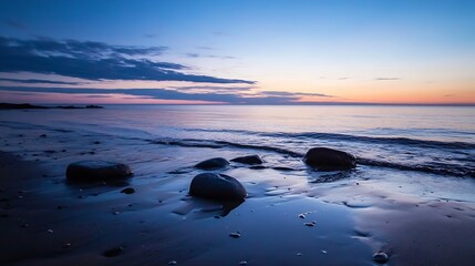 Peaceful beach landscape at twilight with smooth rocks and calm water under a colorful sky : Generative AI