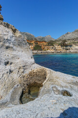 Hole of petrified tree trunk at Geopark of Agios Nikolaos a Petrified Forest at mediterranean sea coast, Laconia, Peloponnese, Greece