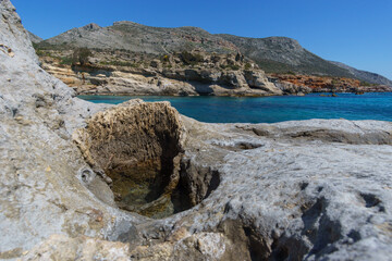 Hole of petrified tree trunk at Geopark of Agios Nikolaos a Petrified Forest at mediterranean sea coast, Laconia, Peloponnese, Greece
