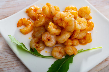 Appetizing baked shrimps with herbs. High quality photo