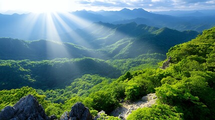 Bright Sun Rays Over Green Mountain Valley Landscape with Dramatic Sky