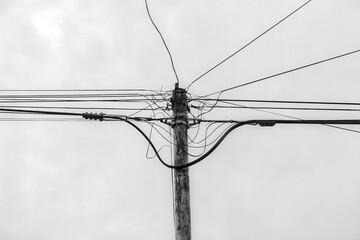 An iron electric pole that supports and connects electricity and internet cables in a housing...