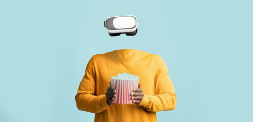 This modern user stands with a virtual reality headset in place of their head, holding a bucket of...