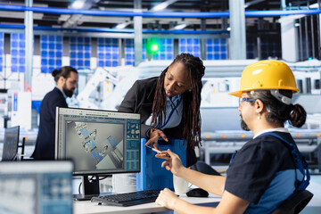 Teamworking photovoltaics factory colleagues reviewing system logs to identify operational inefficiencies. Man and woman in photovoltaic plant adjusting manufacturing parameters
