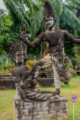 Mythological Stone Sculpture Depicting a Traditional Scene at Xieng Khuan Buddha Park in Vientiane,...