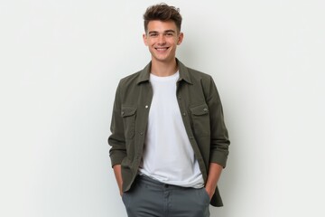 Fototapeta premium Half-Length (Waist-Up) portrait of young stylish smiling Liechtensteiner male model in preppy wear isolated on pure white background looking at camera