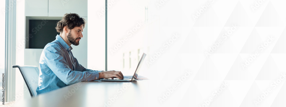 Poster profile side view portrait of focused man manager working on laptop computer in modern office, serio