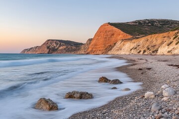 Golden Hour's Embrace A Serene Coastal Scene of Beach and Dramatic Cliffs