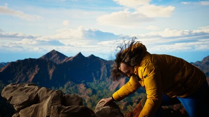 Clumsy hiker tripping and falling off of a mountain peak cliff, leading to an accident due to lack...