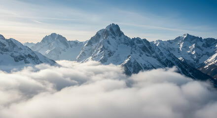 Snowy Mountain Peaks Rising Above a Sea of White Clouds