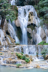 Majestic Main Cascade of Kuang Si Falls Surrounded by Lush Forest in Luang Prabang, Laos &ndash; Iconic Multi-Tiered Waterfall with Turquoise Pools