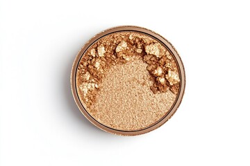 Gold shimmer cosmetic powder in a clear round container