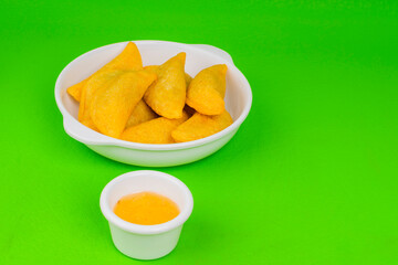 Colombian empanada with spicy sauce 