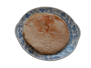 Tasty crepe on the white blue patterned plate.