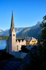 Hallstatt, Austria – September 28, 2023 - Evangelical Church Tower on Lake Hallstatt Austria. The...