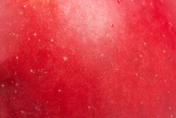 Red apple texture as background. Apple skin macro photo.
