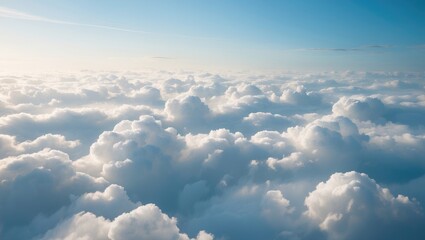 Fototapeta premium High nature view of large white clouds against a gentle sky backdrop in the morning, perspective of white clouds over the plane.