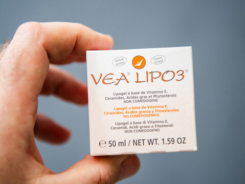 Paris, France - Mar 10, 2025: A hand holds a VEA LIPO3 box showing product details in multiple languages, highlighting Vitamin E-based lipogel with ceramides and phytosterols,