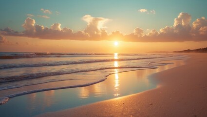 Obraz premium A radiant sunrise over a sandy beach, with waves softly crashing and the horizon illuminated with warm, golden light.