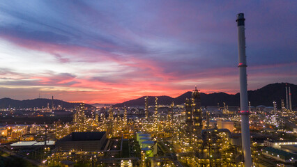 Oil Refinery plant at sunset. Gas Chemical Equipment Prodiction import export Concept, Crude Oil Refinery Plant Steel Pump Pipe line and Chimney and Cooling tower, Chemical Petrochemical