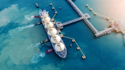 LNG (Liquified Natural Gas) tanker anchored in Gas terminal gas tanks for storage. Oil Crude Gas...