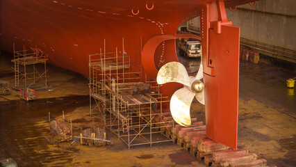 Propeller of large ship spinning power working and water splash contrail . Close up image detail...