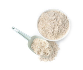 Brown rice flour in bowl and scoop isolated on white, top view