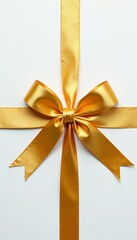 Fototapeta premium Shimmering gold ribbons tied in bow on blank white surface, festive, metallic, celebration