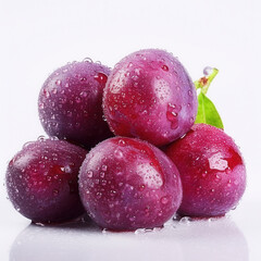Obraz premium Purple plums covered with water drops on white background