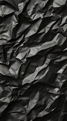 Obraz premium Crumpled dark material texture close-up.