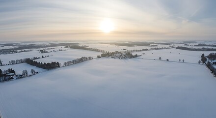 Obraz premium Snowy Fields at Sunrise Aerial View Winter Landscape Scenery