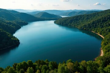 Naklejka premium Irregular shaped lake with winding shoreline & forested banks, overhead, banks, aquatic