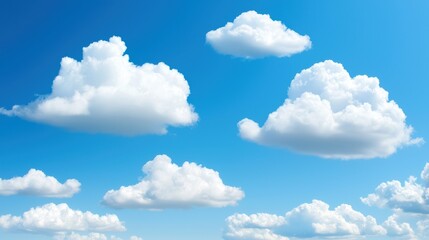 Fototapeta premium A serene sky filled with fluffy white clouds against a vibrant blue background, creating a tranquil and uplifting atmosphere.