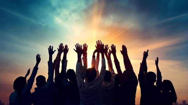 Hands to heaven, group of people with their hands up looking at the sunset	
