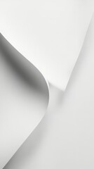 Fototapeta premium Abstract white forms create a minimalist design with smooth curves and shadows against a stark background.
