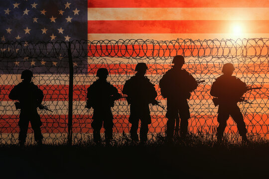 Silhouetted Figures of Soldiers Against Barbed Wire Fence with US Flag Background Depicting National Border Security. memorial day concept