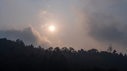 Shot of the sun with clouds 1