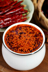 Chili oil is a traditional spice made by deep frying chili powder at high temperature.