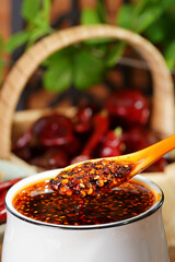Chili oil is a traditional spice made by deep frying chili powder at high temperature.