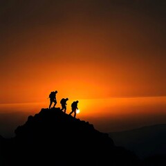 People climb a mountain at sunset, their forms silhouetted against the warm, dark sky