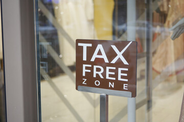 Tax free shopping sign outside retail store in urban location