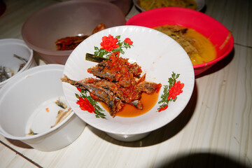 There's delicious food on the table: fish, vegetables, and rice