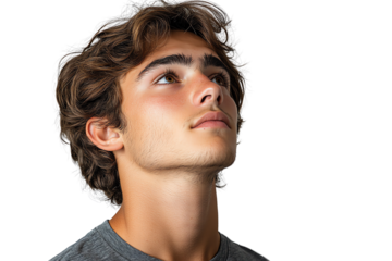 A young man with curly hair gazing upwards, displaying a thoughtful expression, isolated against a white background.