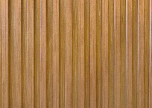 Natural brown oak wood fluted panel or fluted strips, rustic wood, seamless texture.