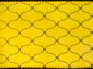 Close up of random ellipse and oval repetitive pattern with yellow background. Printed fabric...