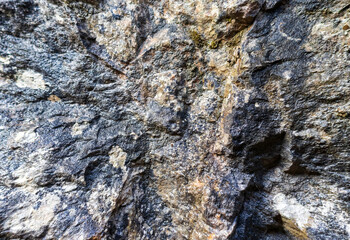 the walls of a stone gorge in a mountainous area, the structure of a geological section